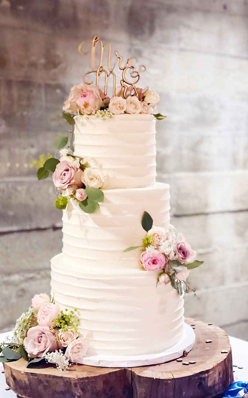 White Wedding Cake with Pink Flowers